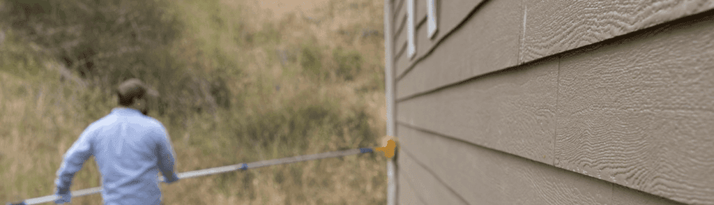 Exterior pest control treatment along a home